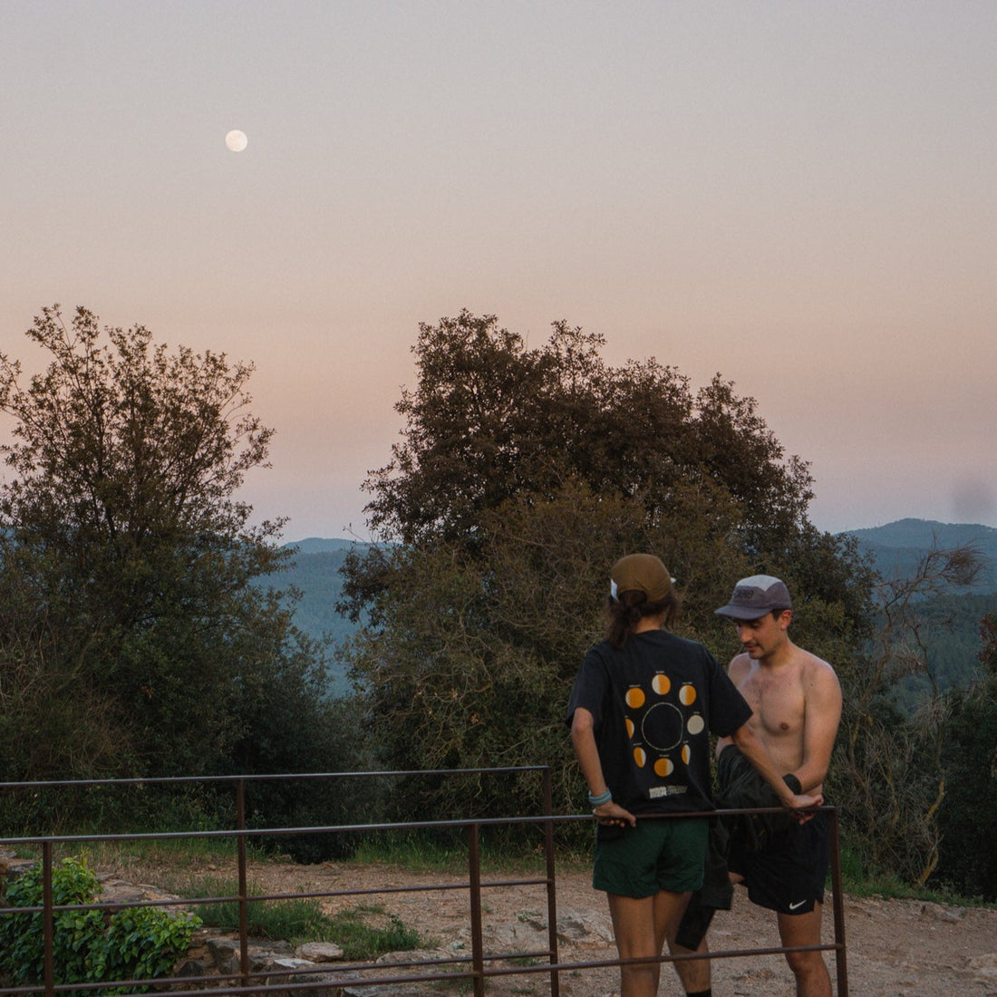 Two people standing side by side with a black background