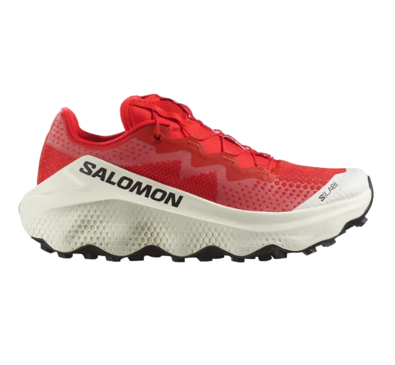 A pair of red and white Salomon S/LAB ULTRA GLIDE trail running shoes with a distinctive sole design.