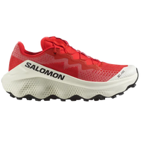 A pair of red and white Salomon S/LAB ULTRA GLIDE trail running shoes with a distinctive sole design.