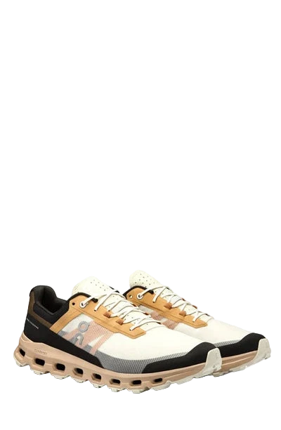 Pair of black, yellow, and white sneakers on a white background