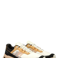 Pair of black, yellow, and white sneakers on a white background