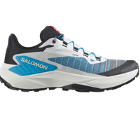 A Salomon GENESIS mountain running shoe with a blue, black, white, and gray color scheme, featuring a dynamic support chassis and grip.