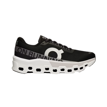 A black and white ON Running Cloudmonster 2 sneaker with a mesh upper and a unique sole design for running.