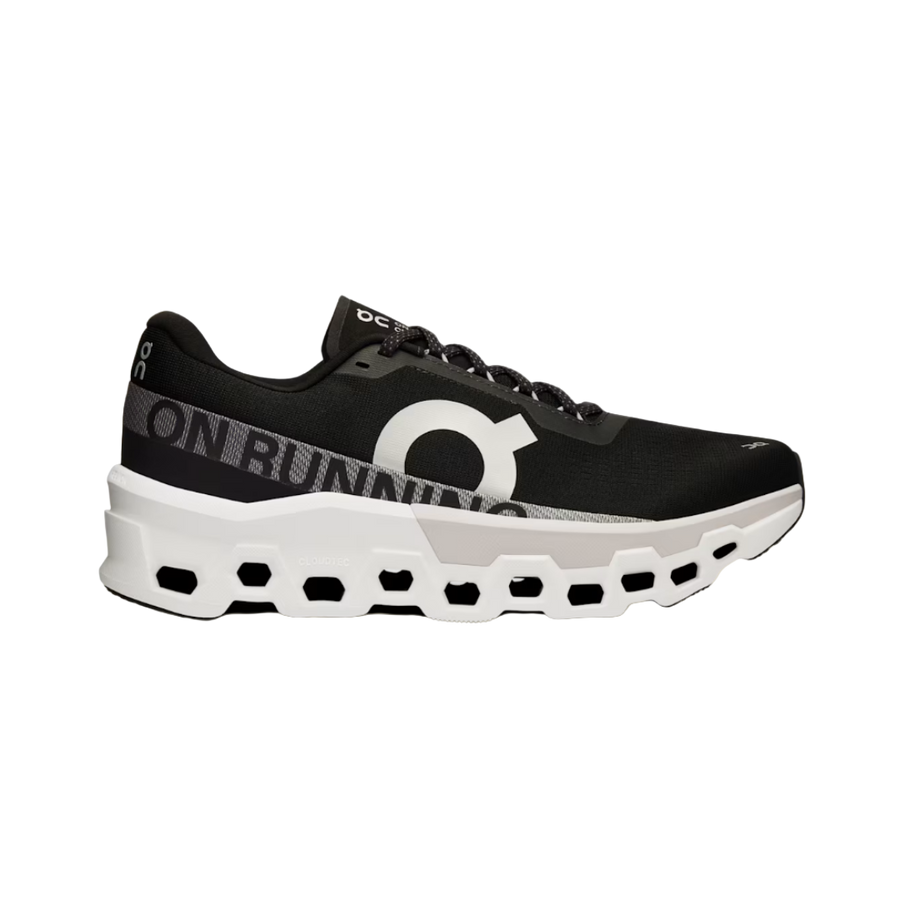 A black and white ON Running Cloudmonster 2 sneaker with a mesh upper and a unique sole design for running.