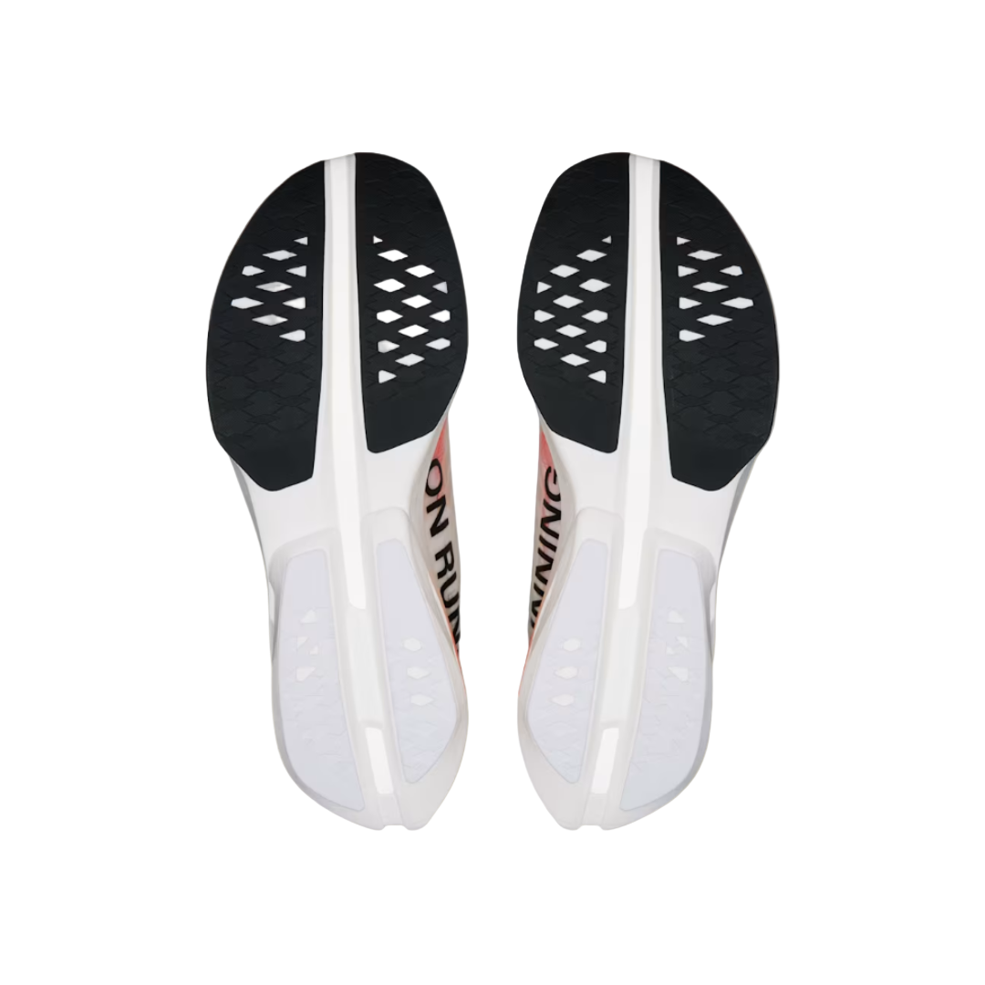 Pair of white shoe insoles with black soles on a beige background