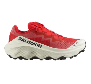 A pair of red and white Salomon S/LAB ULTRA GLIDE trail running shoes with a distinctive sole design.
