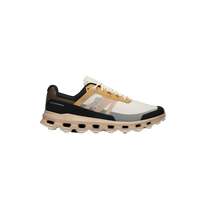 A pair of ON RUNNING Cloudvista trail running shoes with beige, black, and white color scheme, featuring lightweight construction and cushioned soles.