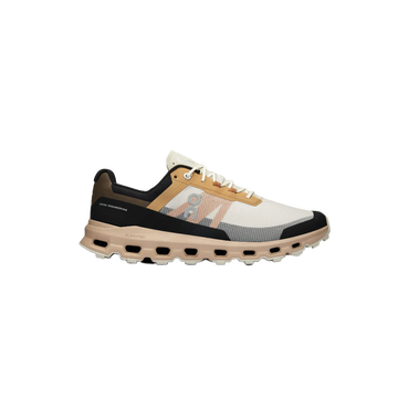A pair of ON RUNNING Cloudvista trail running shoes with beige, black, and white color scheme, featuring lightweight construction and cushioned soles.